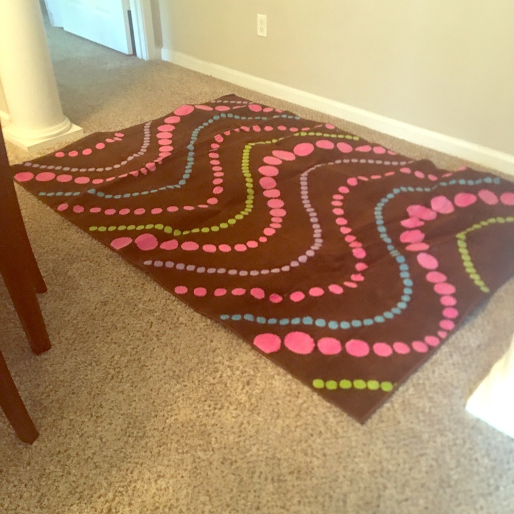 Brown with pink, purple, and teal. Wave dots rug